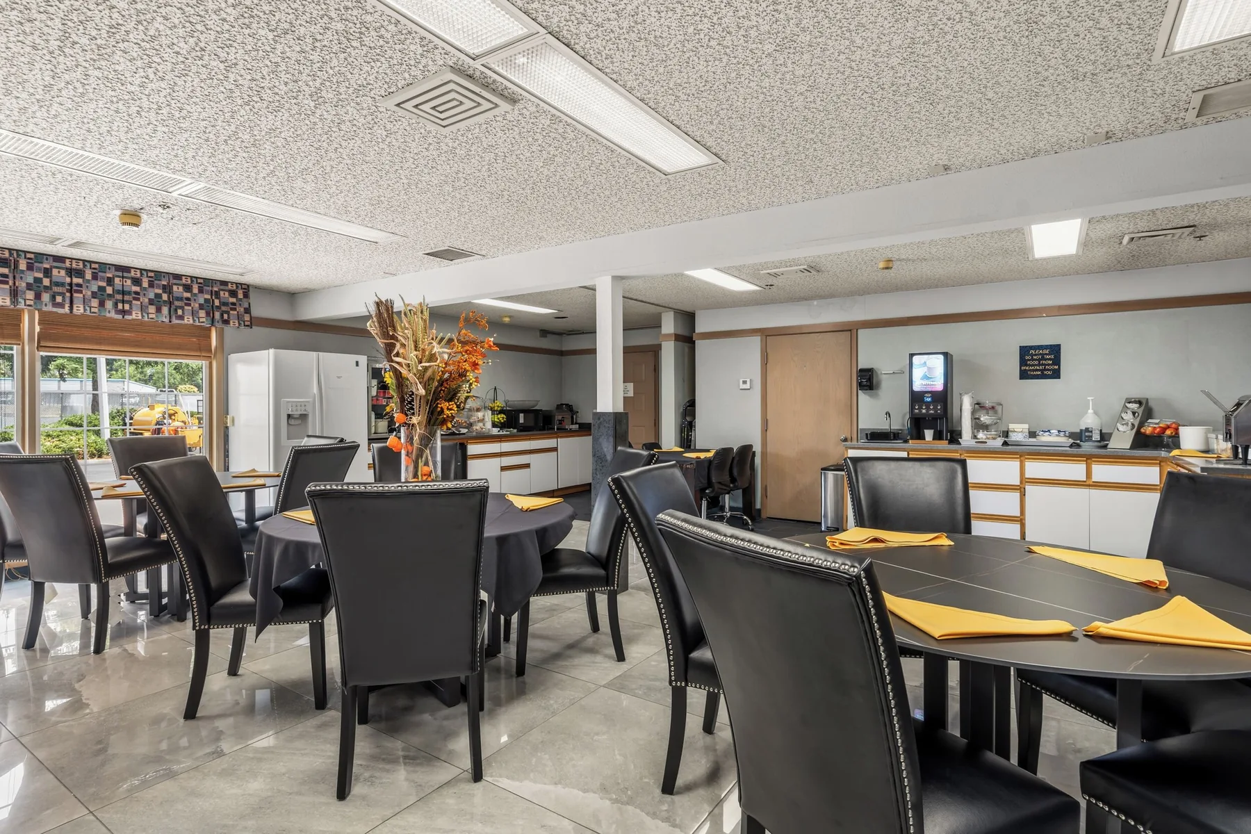 Breakfast dining area with tables and coffee service